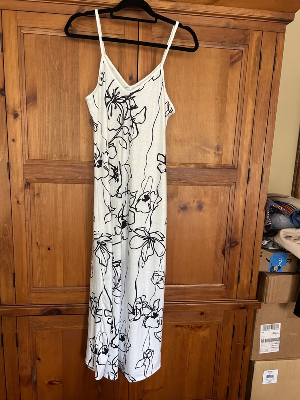 Trendy boutique White Midi Slip Dress with Black Floral Print.